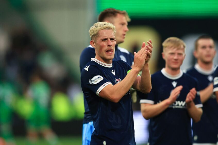 Luke McCowan applauds the Dundee fans at full-time at Easter Road. Image: David Young/Shutterstock