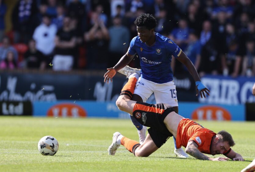 Aaron Essel gets the better of Dundee United's Kevin Holt. 