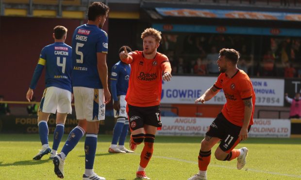 Luca Stephenson wheels away in celebration after scoring for Dundee United