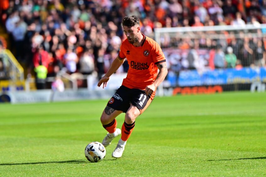 Dundee United star Will Ferry in possession