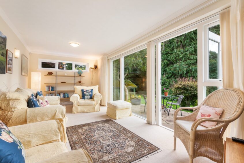 The garden room with a suite and open patio doors