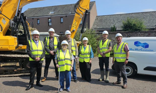Kirrie Connections figures, councillors and contractors mark the start of work. Image: Supplied