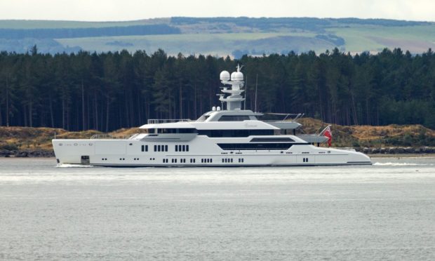 Superyacht Elysian with Tentsmuir Forest in the background.