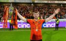 Ross Docherty holds aloft Dundee United's Championship trophy last season