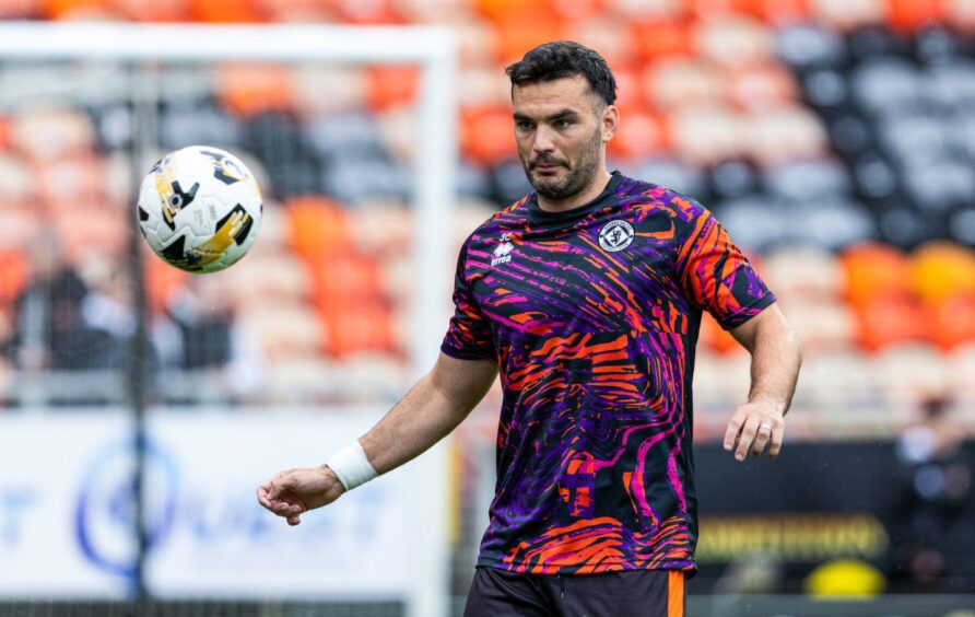 Tony Watt warms up for Dundee United