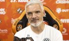 Dundee United boss Jim Goodwin, speaking at a press conference, is all smiles ahead of the visit of the Dee