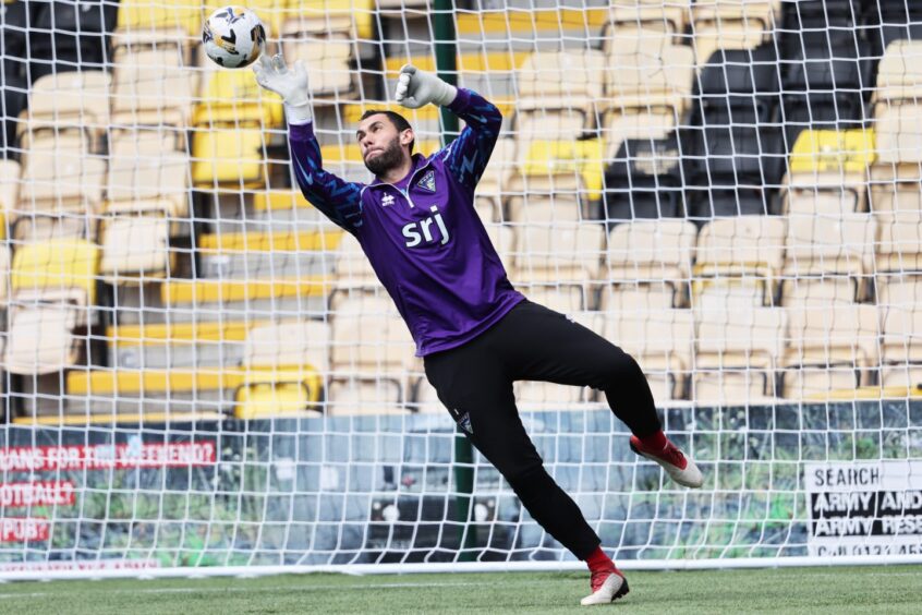 Deniz Mehmet warms up ahead of the Pars' clash with Livingston.