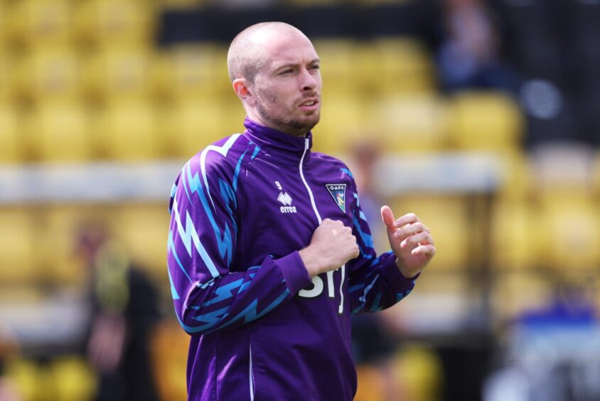 Craig Wighton warms up for Dunfermline Athletic FC.