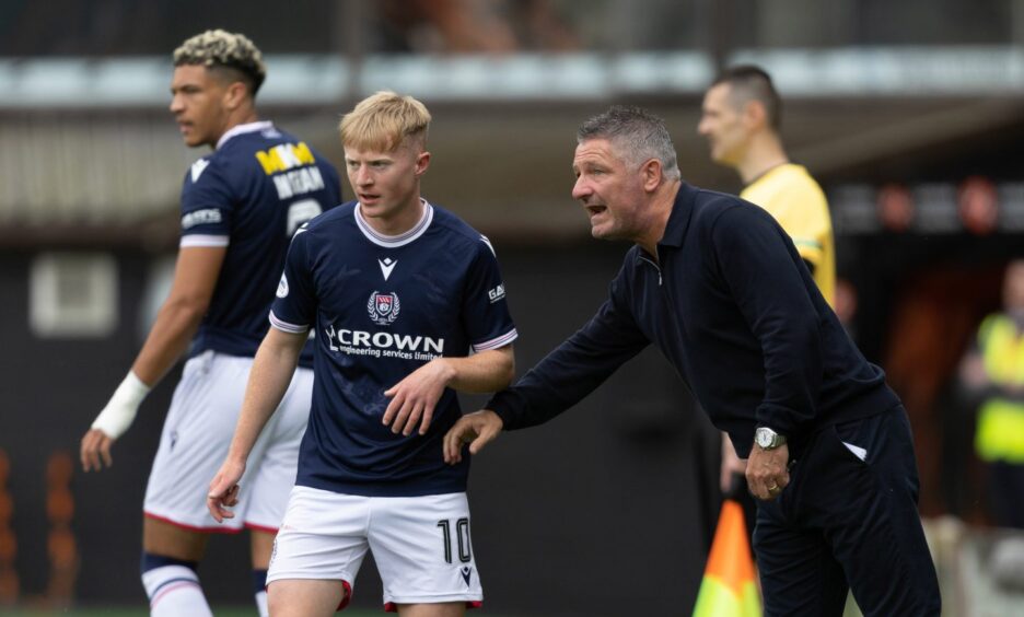 Tony Docherty instructs Lyall Cameron, the man top of Dundee's assist list. Image: SNS