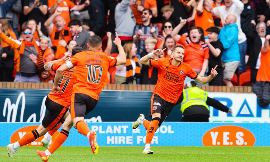 Dundee United's Kristijan Trapanovski wheels away in delight.