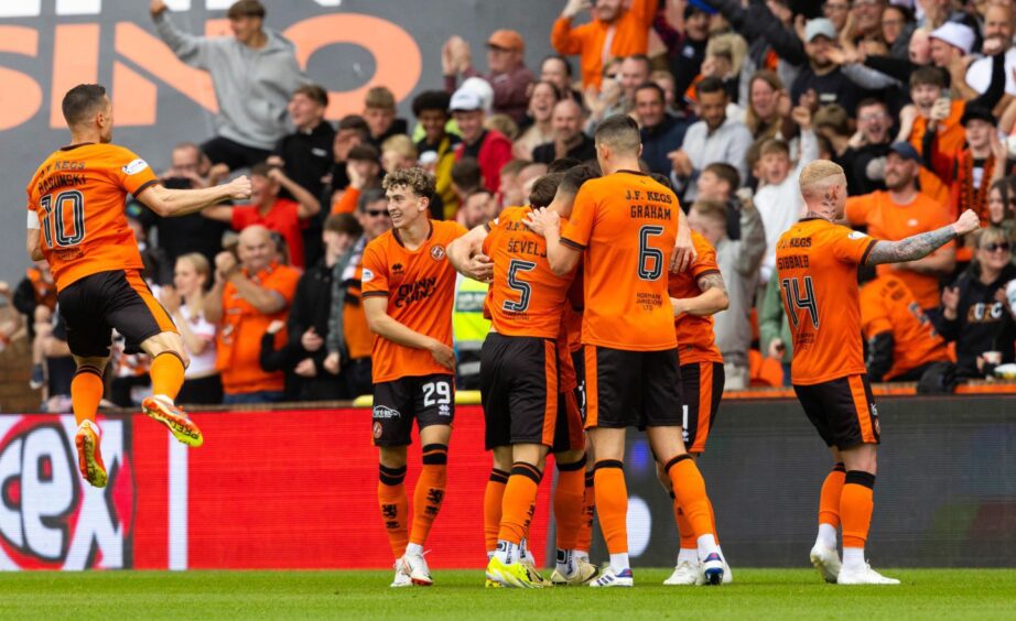 David Babunski, far left, jumps for joy after Kristijan Trapanovski's opener