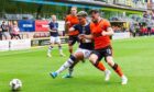 Ethan Ingram and Will Ferry do battle in the first meeting between Dundee and Dundee United