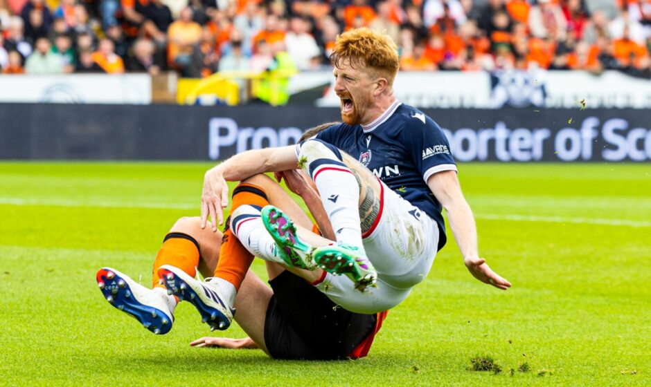 Ross Graham mistimes his challenge on Simon Murray