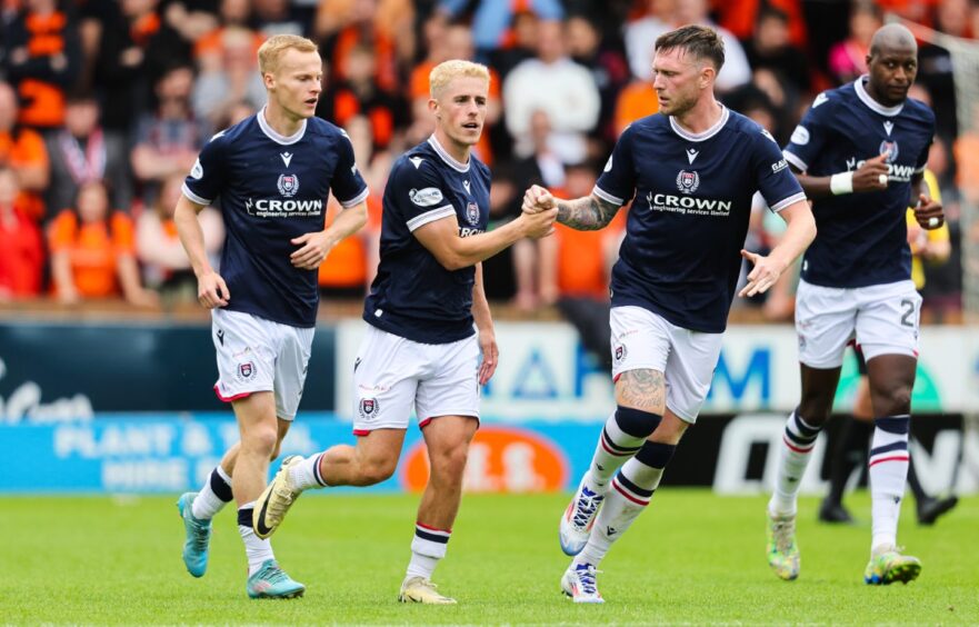 Tiffoney celebrates with Luke McCowan after Dundee equalised at Tannadice. Image: Mark Scates/SNS