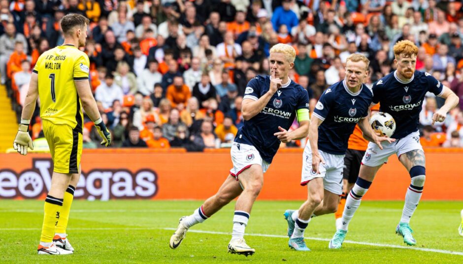 Luke McCowan enjoys the moment after his penalty levelled the scores for Dundee at Dundee United. Image: SNS