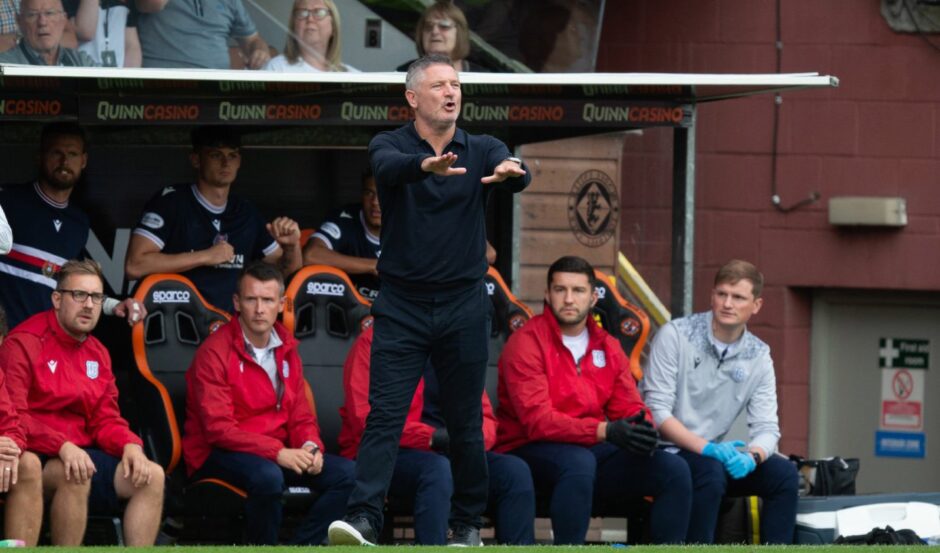 Dundee boss Tony Docherty in the dugout at Tannadice. Image: Paul Bryars/SNS