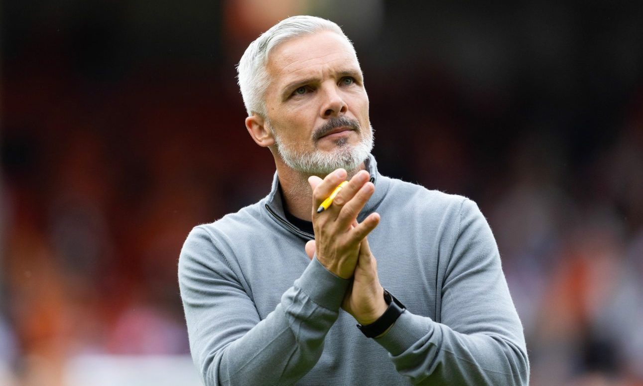 Jim Goodwin applauds the Dundee United faithful.