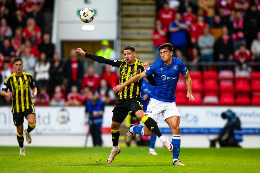 St Johnstone defender Lewis Neilson in aerial action against Aberdeen.