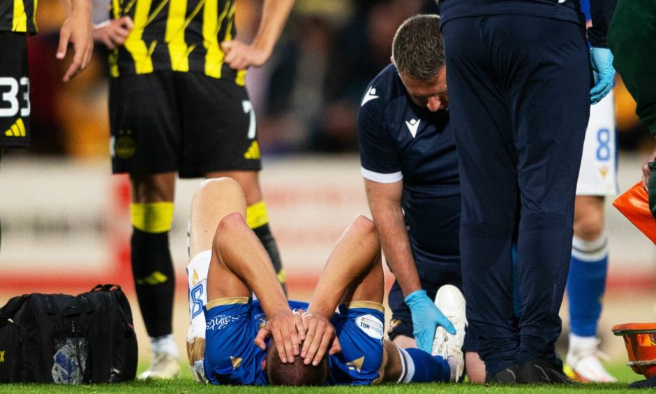 St Johnstone's Sam McClelland lying on the ground after suffering a serious injury.