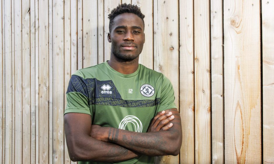 Dundee United midfielder Richard Odada with his arms folded