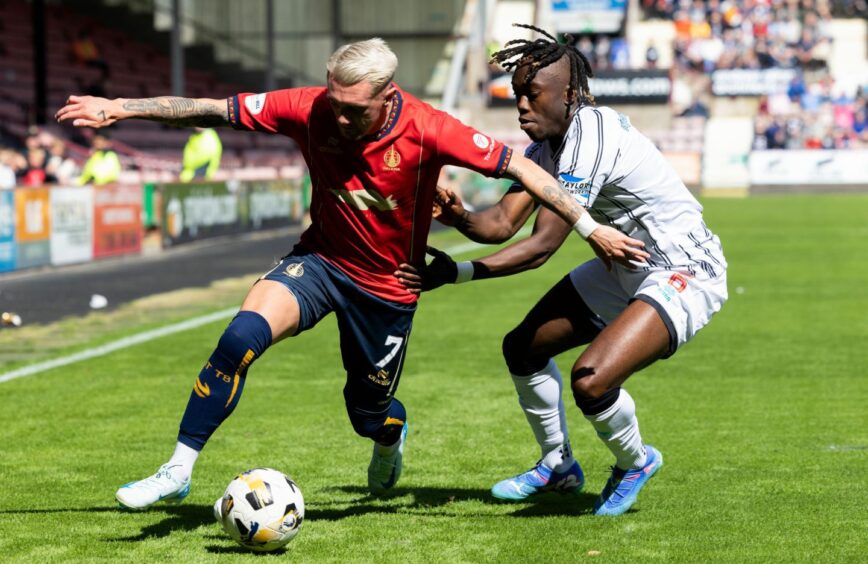 Pars defender Ewan Otoo tries to get to grips with Falkirk winger Callumn Morrison.