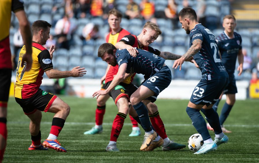 Raith Rovers' Sam Stanton and Dylan Easton battle for possession against Partick Thistle.