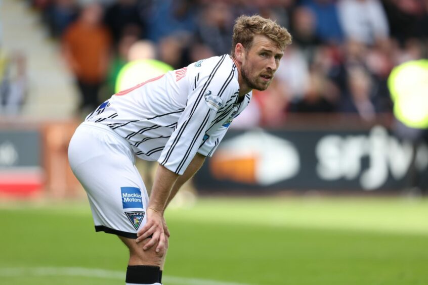 Dunfermline Athletic F.C. midfielder David Wotherspoon bends with his hands on his knees.