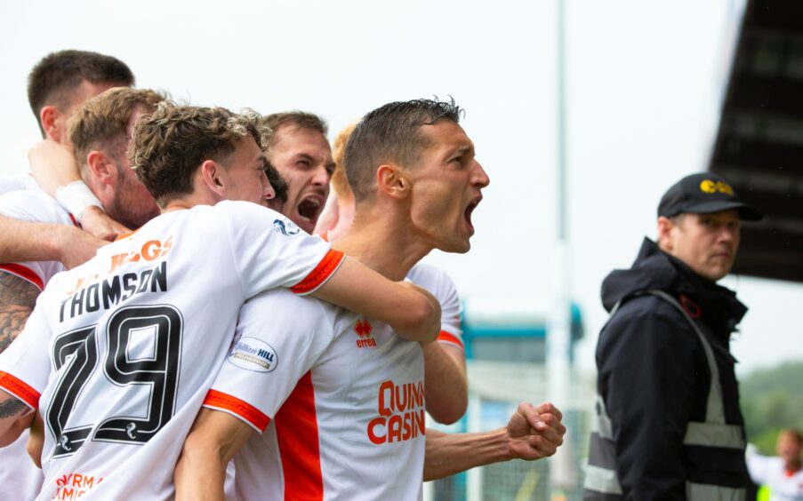 David Babunski celebrates his third competitive goal for the Tangerines