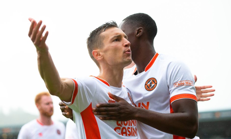 David Babunski takes the acclaim of the 996 travelling Dundee United fans at Ross County