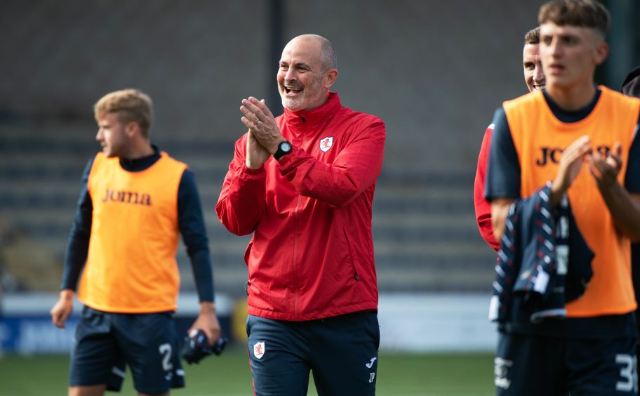 John Potter celebrates at full-time after Raith Rovers' win over Partick Thistle.