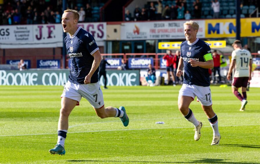 Luke McCowan tees up Scott Tiffoney to open the scoring against Hearts. Image: SNS