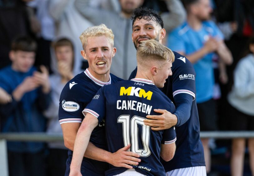 Dundee celebrate after going 3-0 up in the first half against Hearts. Image: SNS