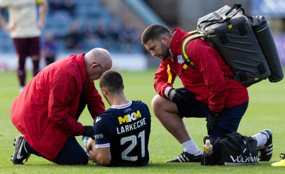 Ziyad Larkeche gets treatment before being stretchered off. Image: SNS