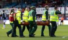 Ziyad Larkeche is stretchered off against Hearts. Image: Ross Parker/SNS