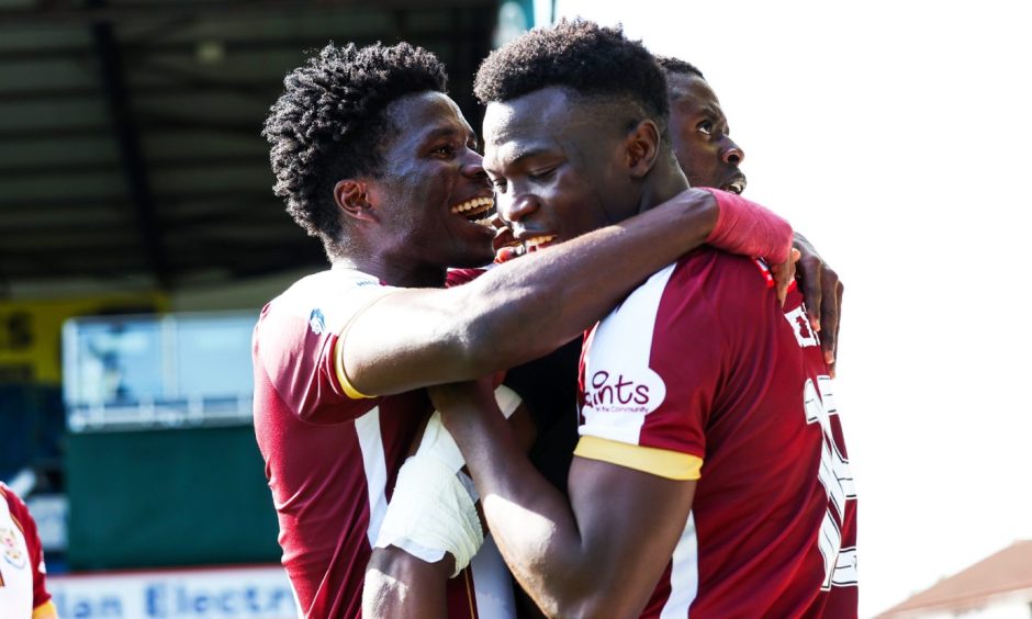 The St Johnstone players celebrate Benji Kimpioka's goal at Kilmarnock after a great move.