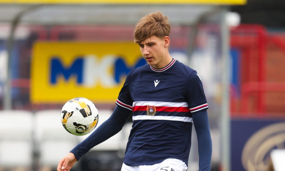 Dundee youngster Seb Lochhead warms-up ahead of a League Cup clash with Airdrieonians. Image: Ross MacDonald/SNS