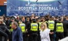 Police forming a barrier outside Hampden after a fan incident before the Rangers v St Johnstone game.