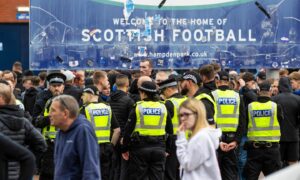 Police forming a barrier outside Hampden after a fan incident before the Rangers v St Johnstone game.