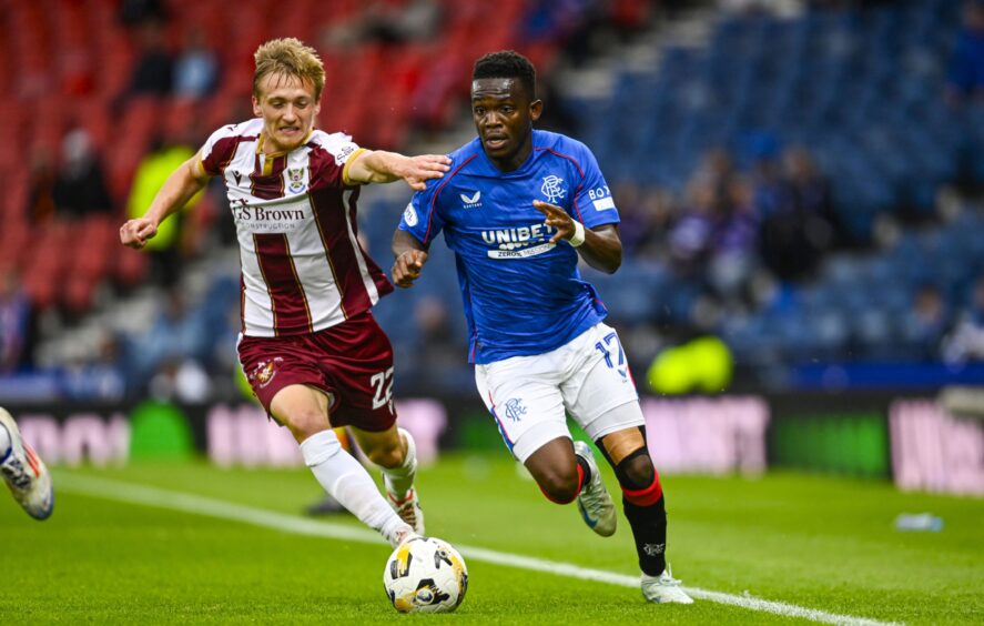 Matt Smith tracks Rangers' Rabbi Matondo.