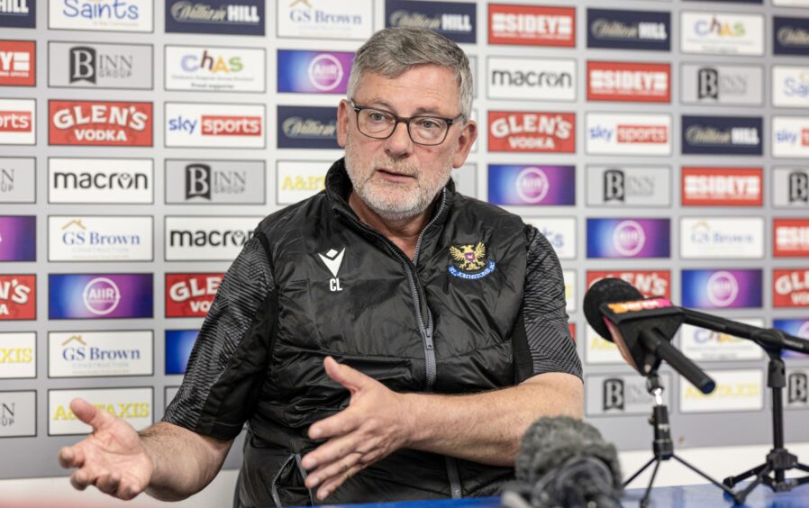 St Johnstone manager Craig Levein sits at a table during a press conference