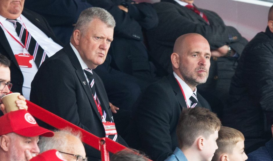 Dunfermline CEO and chairman David Cook watches the defeat to Hamilton Accies alongside director Drew Main.