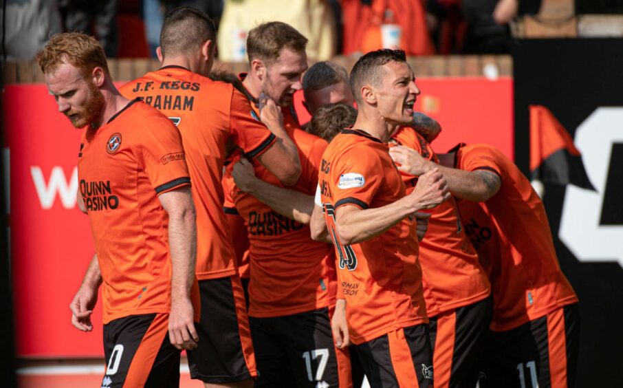 Dundee United players celebrate United's opener