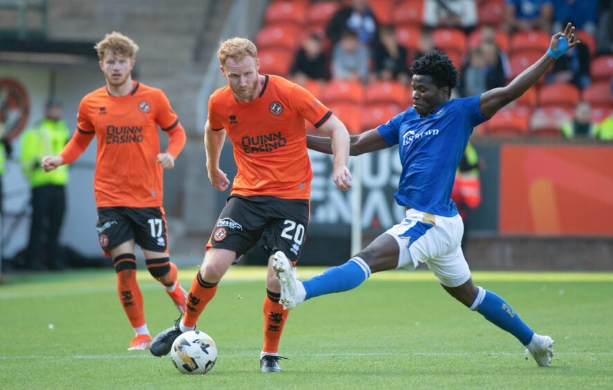 Aaron Essel challenges Dundee United's Jort Van Der Sande.