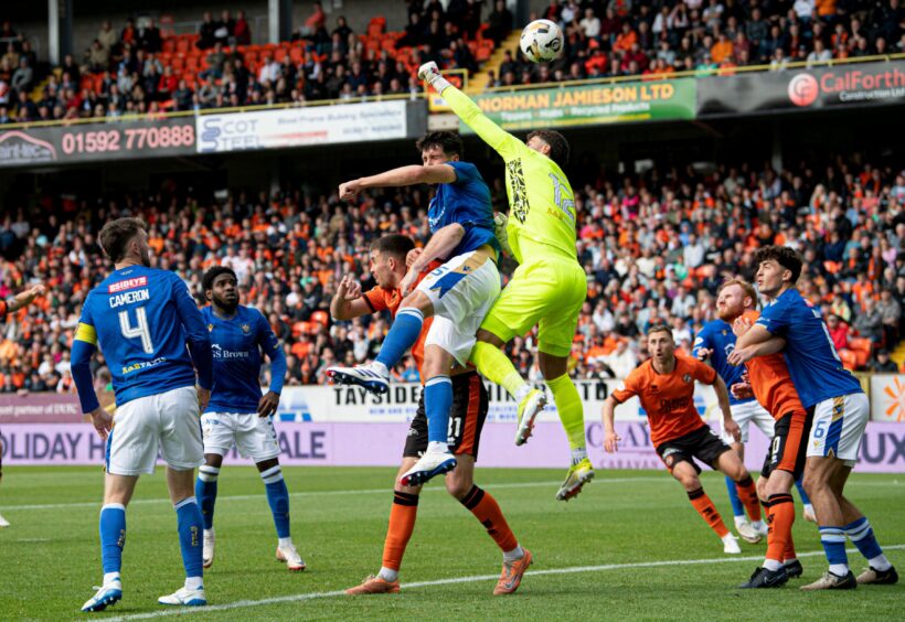 Jack Sanders finds the back of his own net in a crowded goalmouth as St Johnstone take on Dundee United