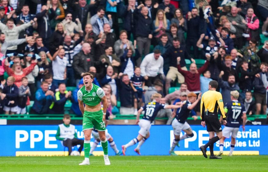 Dundee fans lose it in the away end. Image: Simon Wootton/SNS