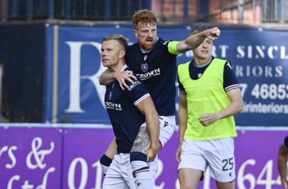 Curtis Main and Dundee skipper Simon Murray celebrate Main's equaliser. Image: Rob Casey/SNS