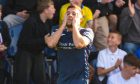 Raith Rovers striker Lewis Vaughan holds his head in his hands.