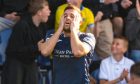 Raith Rovers striker Lewis Vaughan holds his head in his hands.