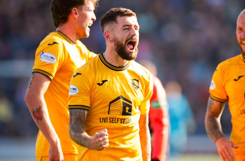 Jamie Brandon celebrates Livingston's dramatic late winner against Raith Rovers.