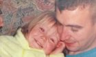 David Haines as a young dad with his baby daughter Bethany.